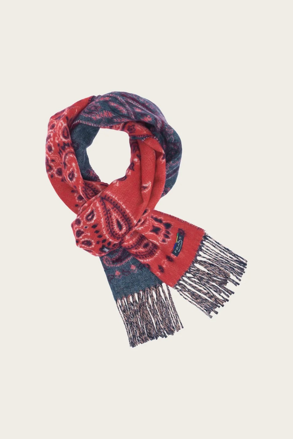 A red and grey paisley scarf, with fringe, photographed against a light background.