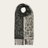 A grey and paisley scarf, with fringe, photographed against a light background.