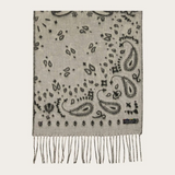 A grey and paisley scarf, with fringe, photographed against a light background.