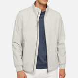 Short jacket for men with a stylishly casual design that will be ideal for cool summer days. This original version has been made from lightweight recycled polyester with a matte surface in a lustrous muted-gray palette. Spherica™ is water-repellent and windblocking, and will perfectly complete everyday city styling while delivering outstanding comfort and breathability.