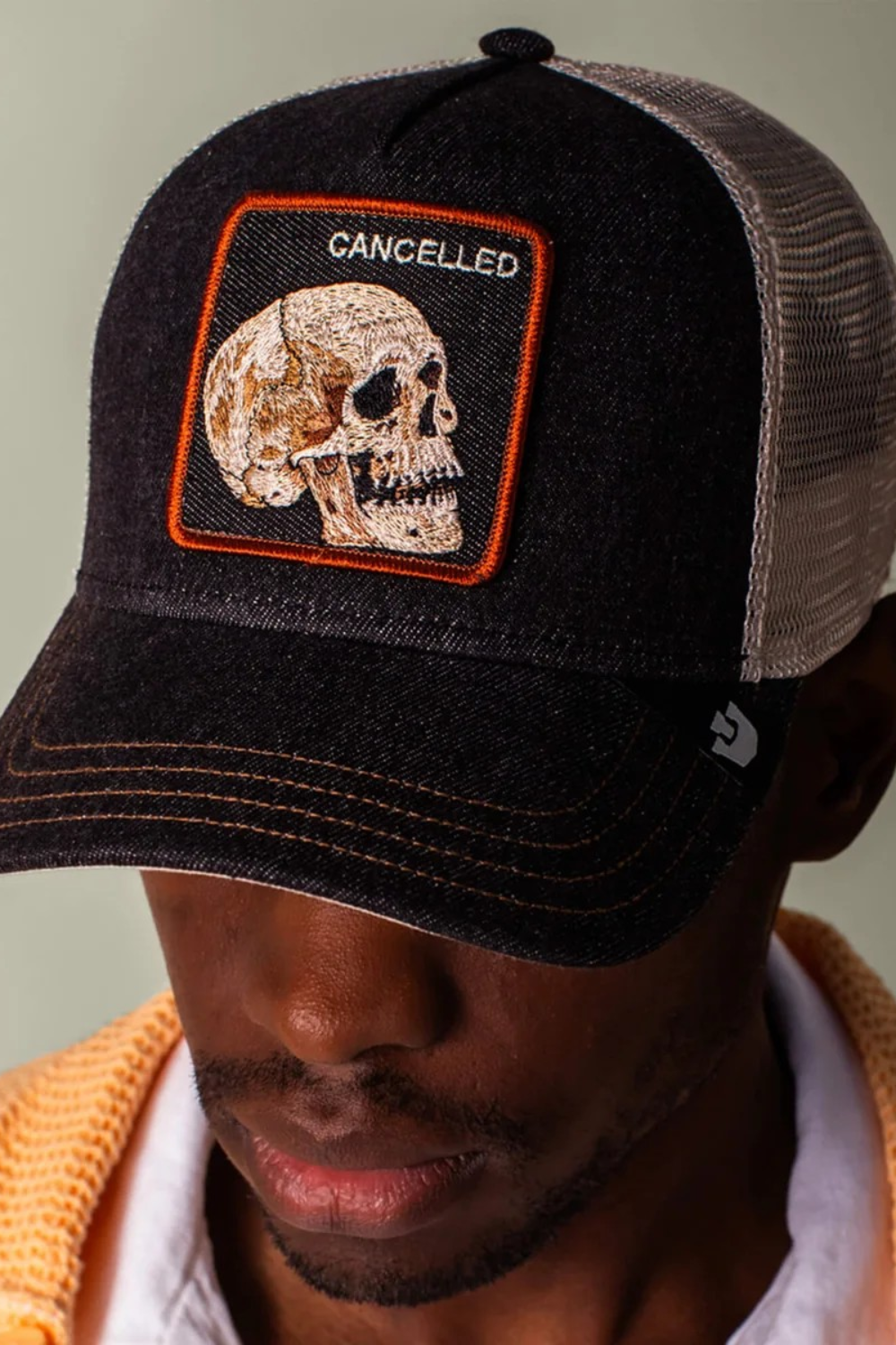 Black denim keeps it grounded while the skull patch stamped CANCELED says what everyone’s thinking. This one’s already dead, so it can’t be killed twice. Dark wash, bone-white skull energy, and zero concern for public approval.