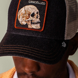 Black denim keeps it grounded while the skull patch stamped CANCELED says what everyone’s thinking. This one’s already dead, so it can’t be killed twice. Dark wash, bone-white skull energy, and zero concern for public approval.