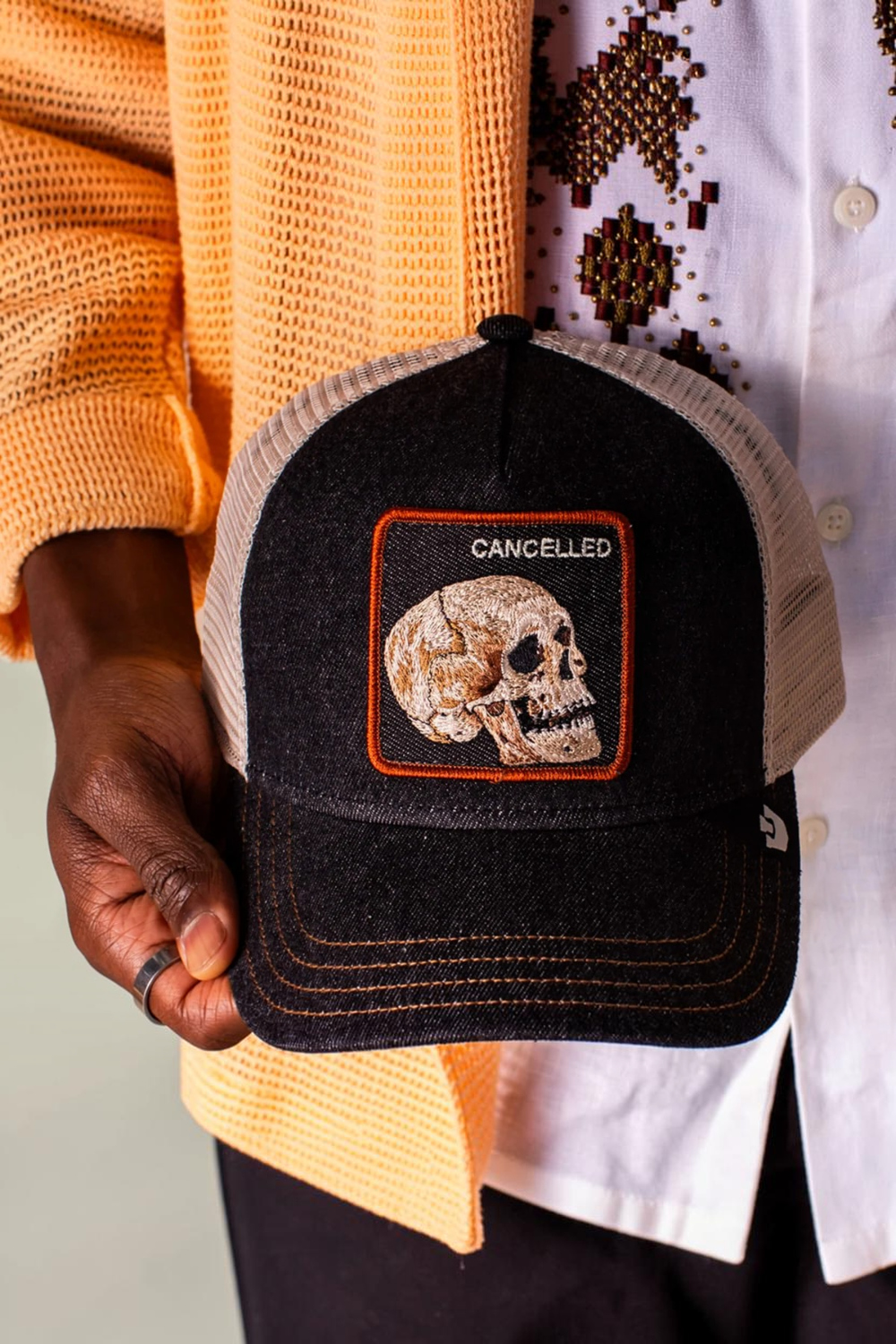 Black denim keeps it grounded while the skull patch stamped CANCELED says what everyone’s thinking. This one’s already dead, so it can’t be killed twice. Dark wash, bone-white skull energy, and zero concern for public approval.