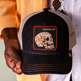 Black denim keeps it grounded while the skull patch stamped CANCELED says what everyone’s thinking. This one’s already dead, so it can’t be killed twice. Dark wash, bone-white skull energy, and zero concern for public approval.