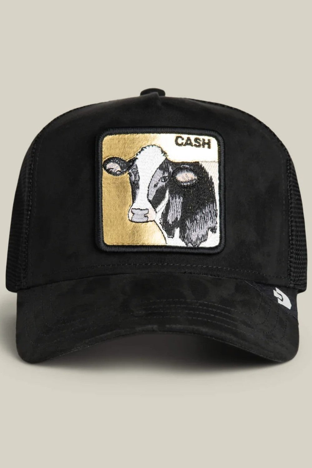 All black suede with a gold-backed cow patch that spells CASH, because subtlety doesn’t pay the bills. The black colorway keeps it serious while the cow patch quietly flexes dairy-farm-meets-bull-market energy. Calm face, heavy value, and zero interest in spare change.