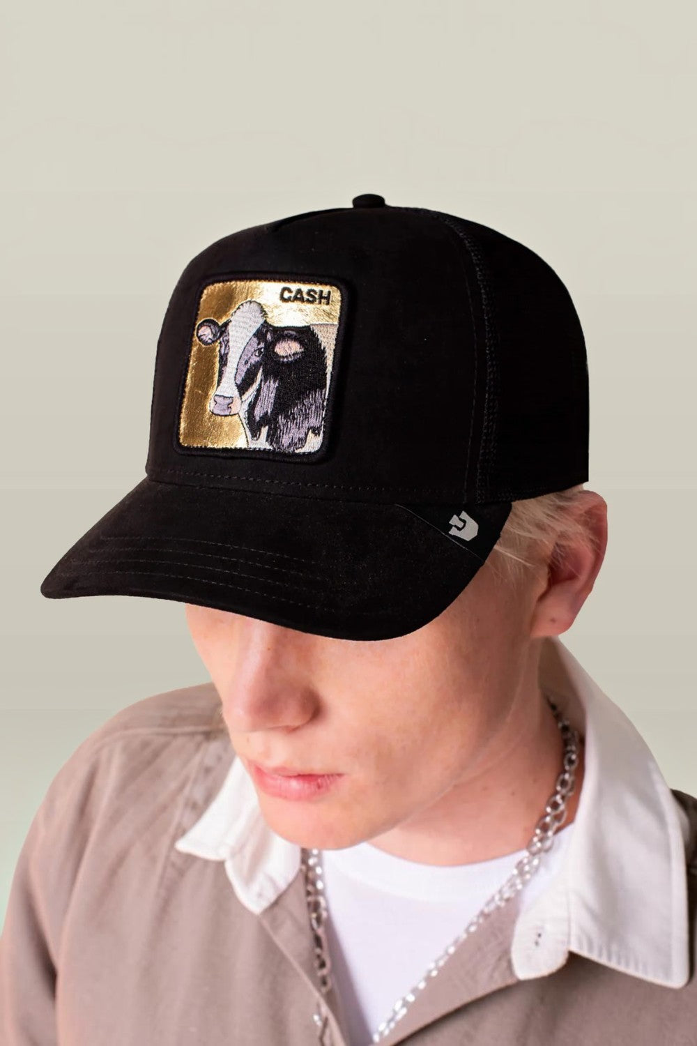 All black suede with a gold-backed cow patch that spells CASH, because subtlety doesn’t pay the bills. The black colorway keeps it serious while the cow patch quietly flexes dairy-farm-meets-bull-market energy. Calm face, heavy value, and zero interest in spare change.