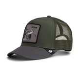 An olive green and dark gray trucker hat with a rectangular patch on the front displaying a hunting scene and the word 'OUTLAW'. The hat features a dark gray visor, dark gray mesh back panels, and a black button on top.