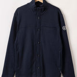 Wind-lined milano knitted jacket / overshirt in 100% cotton. Hidden zipper with button placket and chest pocket. Practical pockets on the sides with zipper. Regular fit. The sweater has a windproof lining that consists of 96% polyester and 4% elastane. No chemicals are used to achieve the windproof function. Instead, the lining is manufactured with a special weaving technique that makes the fabric extremely tightly woven and therefore also windproof, while the fabric breathes.
