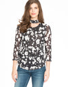 Groove your way to the hottest look with this Spense Printed Mesh Choker Top!