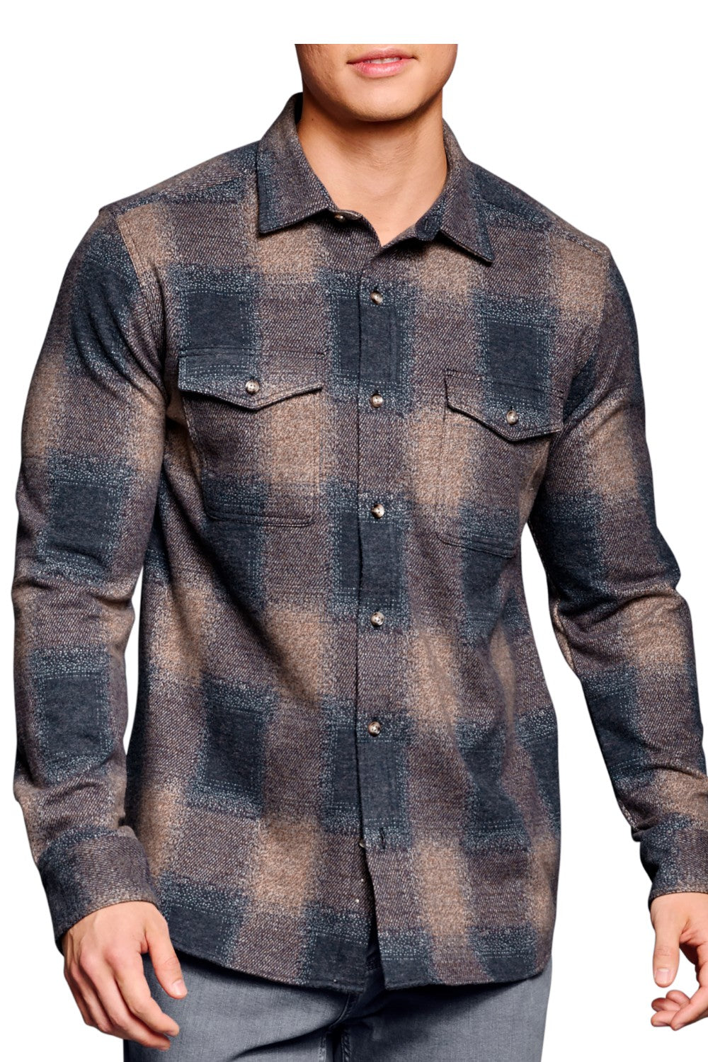 Experience the ultimate comfort and style with the Johnston &amp; Murphy Brushed Button Front Overshirt. Made from a super soft knit fabric, this overshirt offers maximum stretch and a dashing silhouette. It can be worn as a shirt or layered over a tee for a versatile look. Complete with rounded button-flap chest pockets and a shirttail hem, this is a must-have for any wardrobe.&nbsp;