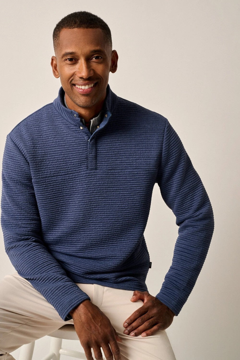 This tech-forward, snap quarter-zip is made with a textured blend of recycled material that looks cool, feels cool and performs like a champ