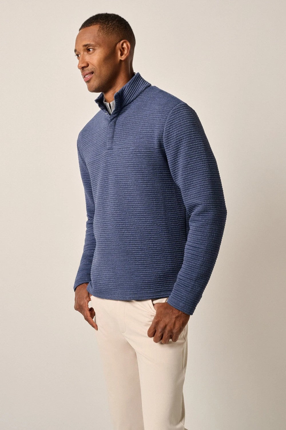 This tech-forward, snap quarter-zip is made with a textured blend of recycled material that looks cool, feels cool and performs like a champ