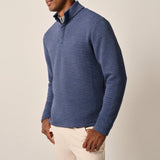 This tech-forward, snap quarter-zip is made with a textured blend of recycled material that looks cool, feels cool and performs like a champ