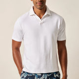 The ultimate poolside style, this terry polo harkens back to the day when lounging under a beach umbrella in the Hollywood Hills was a full-time job. It's made with a lighter version of the fabric used for ultra-luxe towels and it's made with a Johnny collar polo—a mark of the 60s worn by all your favorite style icons.