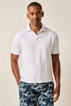 The ultimate poolside style, this terry polo harkens back to the day when lounging under a beach umbrella in the Hollywood Hills was a full-time job. It's made with a lighter version of the fabric used for ultra-luxe towels and it's made with a Johnny collar polo—a mark of the 60s worn by all your favorite style icons.