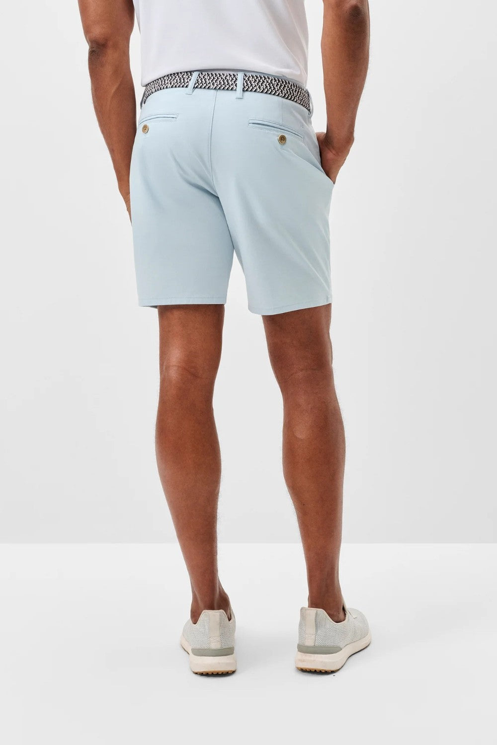 Light blue shorts worn by a person on a white background