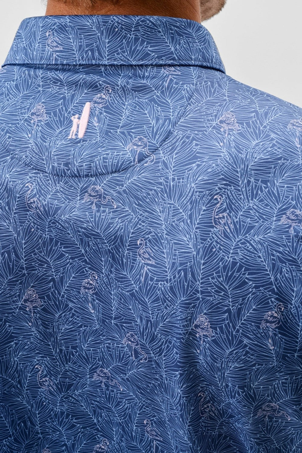 Close-up of a blue patterned shirt with a collar detail.