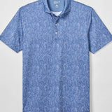 Blue patterned polo shirt on a light gray background