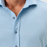 This knit button-down from our Hangin' Out Collection—which is designed to look its best untucked—is made with a modern seersucker fabric that breathes and moves better than the traditional. This is how you do elevated casual while staying completely comfortable.