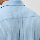 This knit button-down from our Hangin' Out Collection—which is designed to look its best untucked—is made with a modern seersucker fabric that breathes and moves better than the traditional. This is how you do elevated casual while staying completely comfortable.