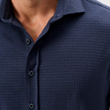 This knit button-down from our Hangin' Out Collection‚ which is designed to look its best untucked, is made with a modern seersucker fabric that breathes and moves better than the traditional. This is how you do elevated casual while staying completely comfortable.