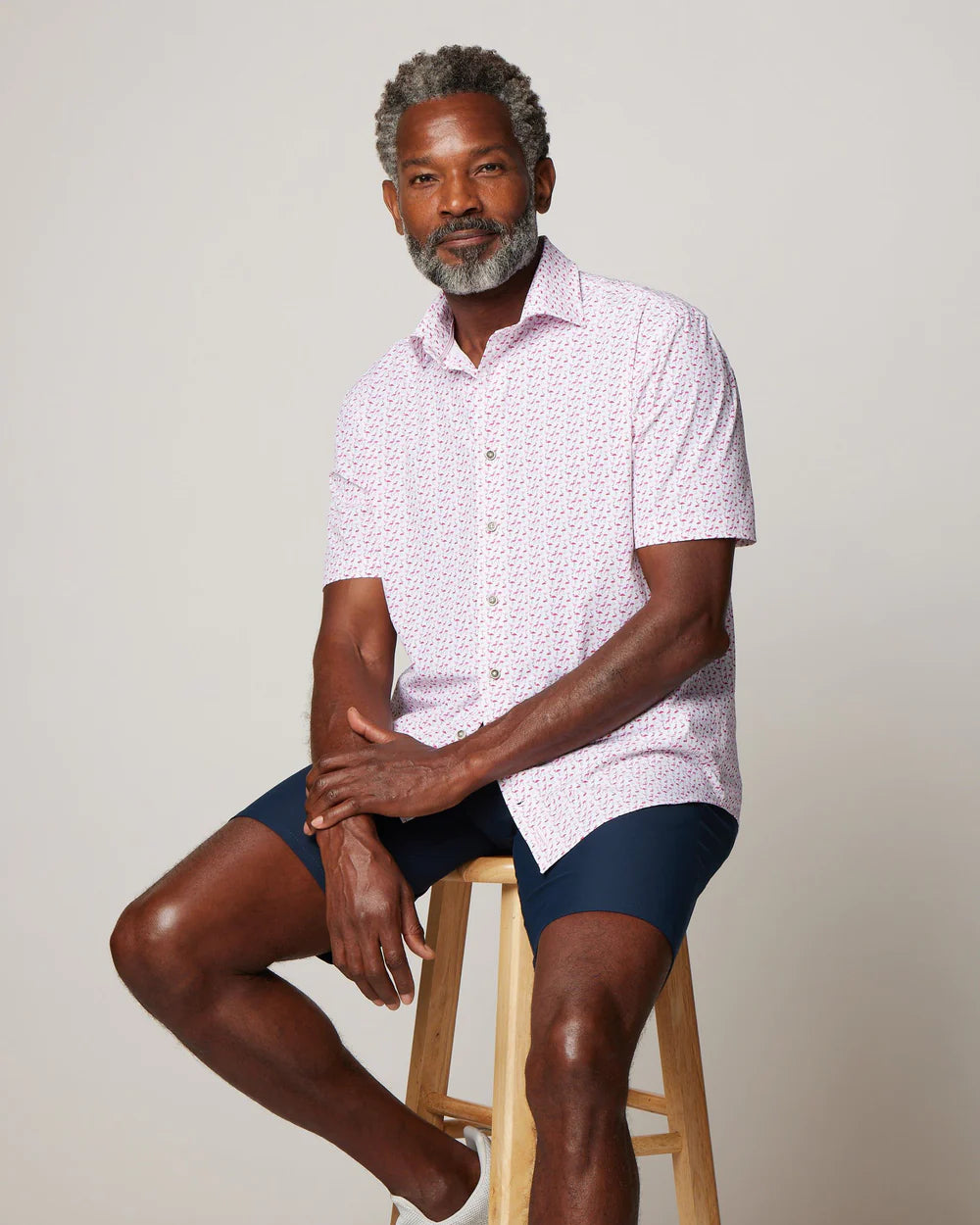 Designed to sit untucked, this shirt is cut like a button-up but with the fabric of a polo so you can take some of that performance comfort and blend it with some jeans or board shorts. Drawn in-house, this clever flamingo print stands out...on one leg.