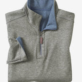 Get cozy and versatile with the Johnston &amp; Murphy 1/4 zip Reversible Fleece. Keep warm and stylish with the soft cotton-blend knit that reverses from a solid to a coordinating heather shade, and stay practical with the quarter zip placket and leather-look pull. Perfect for any occasion with tonal cover-stitch details.