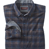 Folded plaid shirt with a visible brand label on a white background