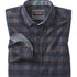 Folded plaid shirt with a visible brand label on a white background