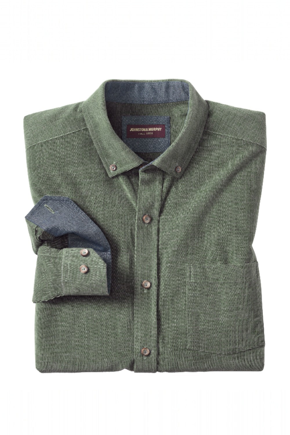 Folded green cardigan with a blue shirt inside on a white background