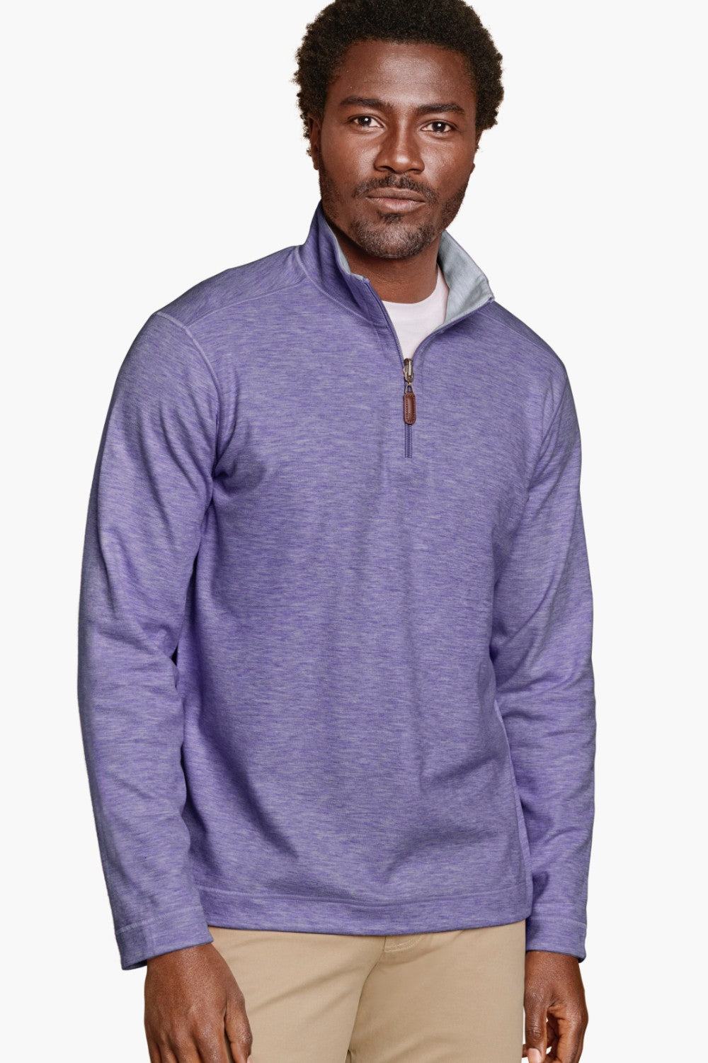 Man wearing a purple quarter-zip pullover on a white background