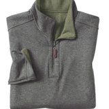 Folded gray pullover with green collar on a white background