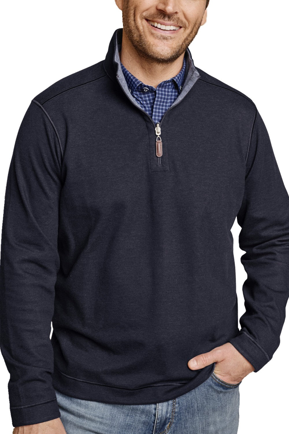 Man wearing a navy quarter-zip sweatshirt over a checkered shirt with a white background