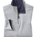 Folded gray pullover with blue collar on a white background