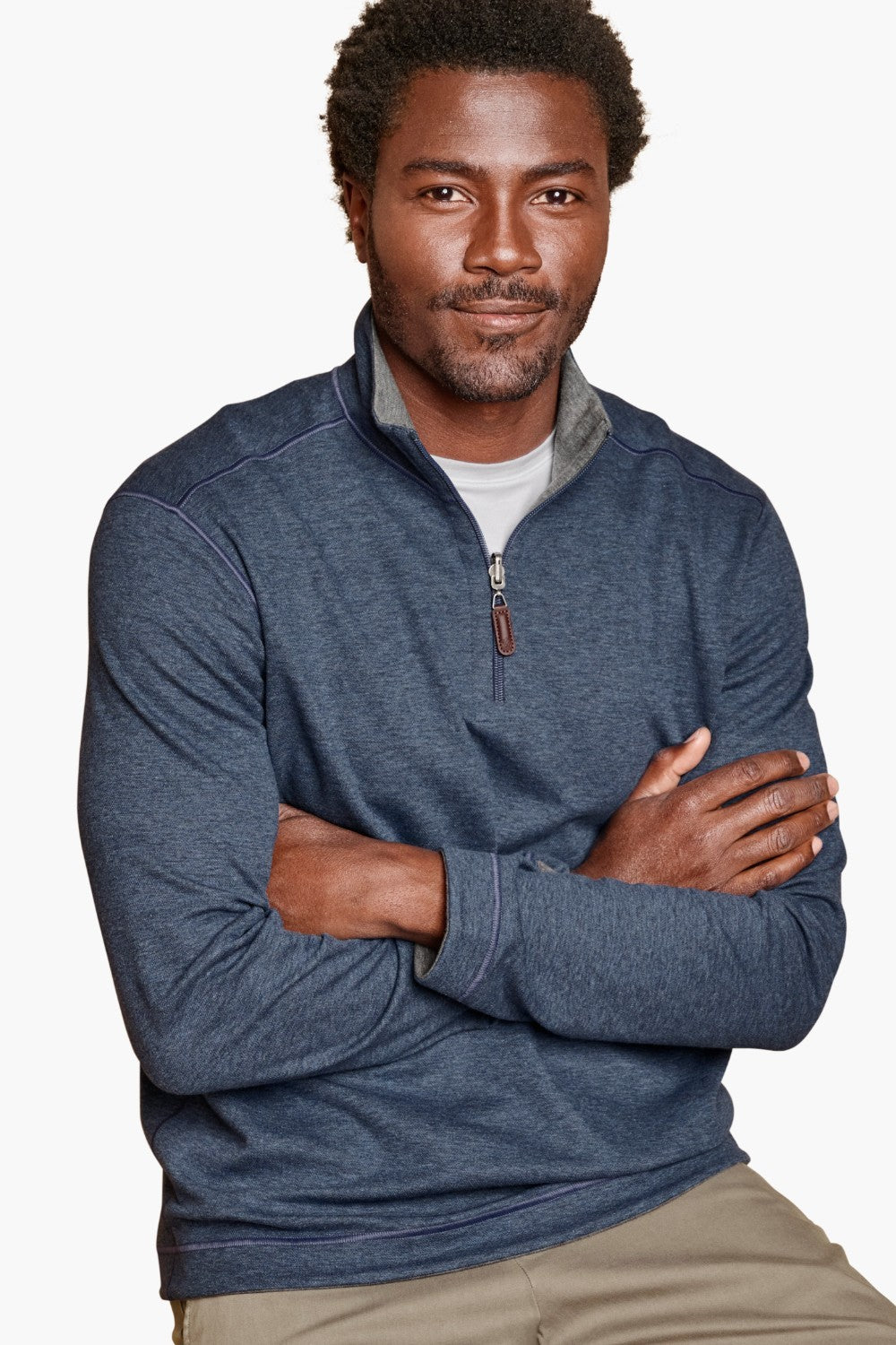 Get cozy and versatile with the Johnston &amp; Murphy 1/4 zip Reversible Fleece. Keep warm and stylish with the soft cotton-blend knit that reverses from a solid to a coordinating heather shade, and stay practical with the quarter zip placket and leather-look pull. Perfect for any occasion with tonal cover-stitch details.