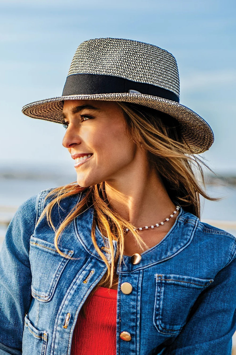 The Josie hat redefines the classic fedora with a moldable wire-edged brim and a sleek wide black ribbon band for effortless elegance. Perfectly packable and versatile, it’s your go-to accessory for daytime outings, tropical escapes, or any stylish adventure. Combine style, practicality, and flair with this must-have hat that’s made to turn heads.