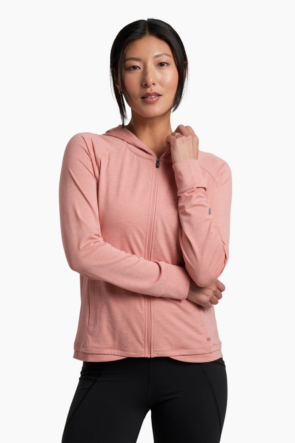 Woman wearing a pink hoodie on a white background