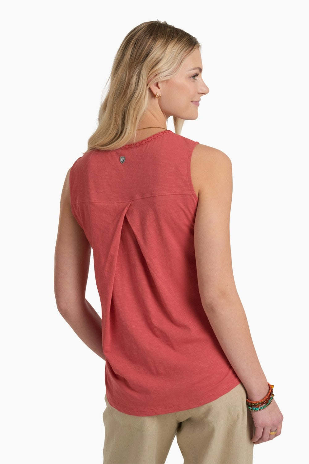 Woman wearing a red sleeveless top on a white background