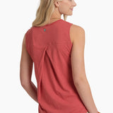 Woman wearing a red sleeveless top on a white background