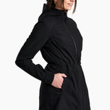 Woman wearing a black coat on a white background