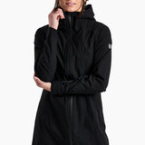 Person wearing a black hooded jacket on a white background