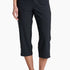 Person wearing black capri pants on a white background