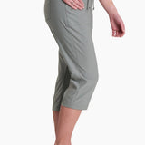 Person wearing gray capri pants on a white background