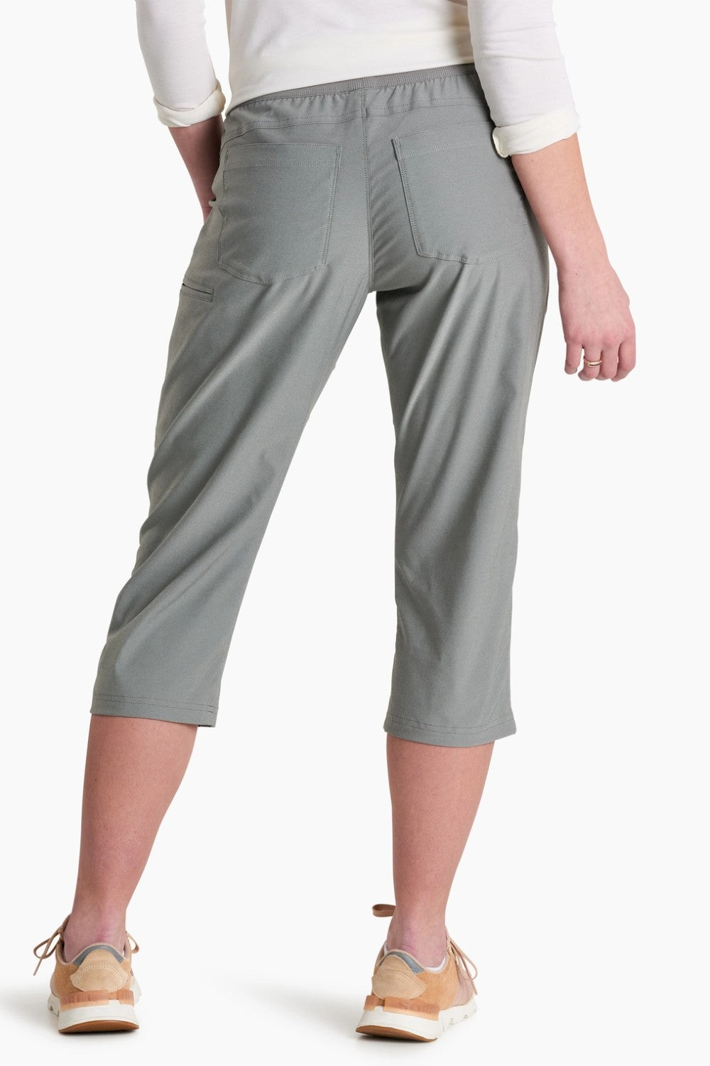 Gray capri pants worn by a person on a white background