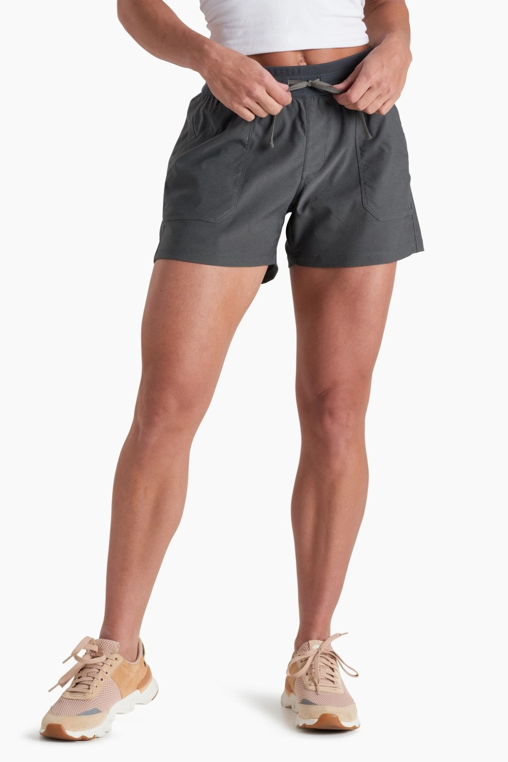 Person wearing gray shorts on a white background