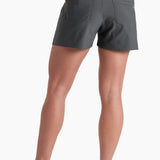 Person wearing gray shorts on a white background