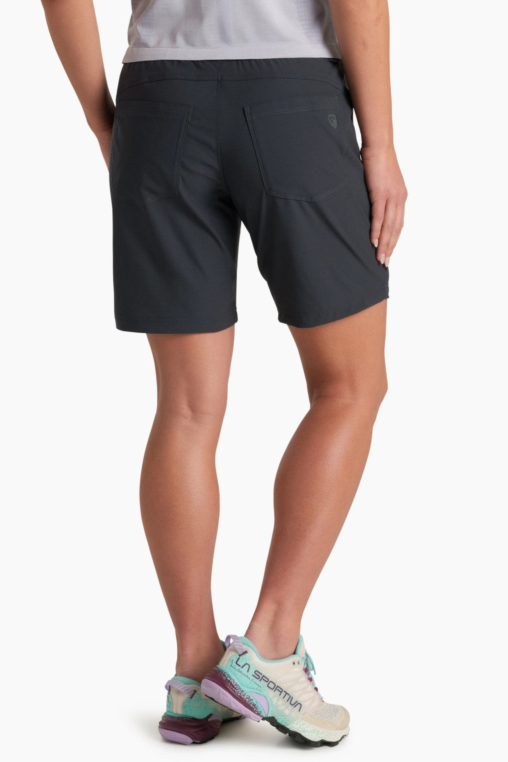 Person wearing black shorts on a white background