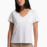 Woman wearing a white t-shirt and beige shorts on a white background