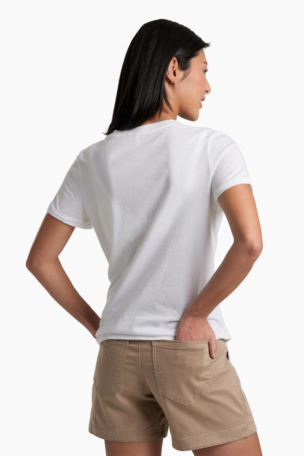 Person wearing a white t-shirt and beige shorts on a white background