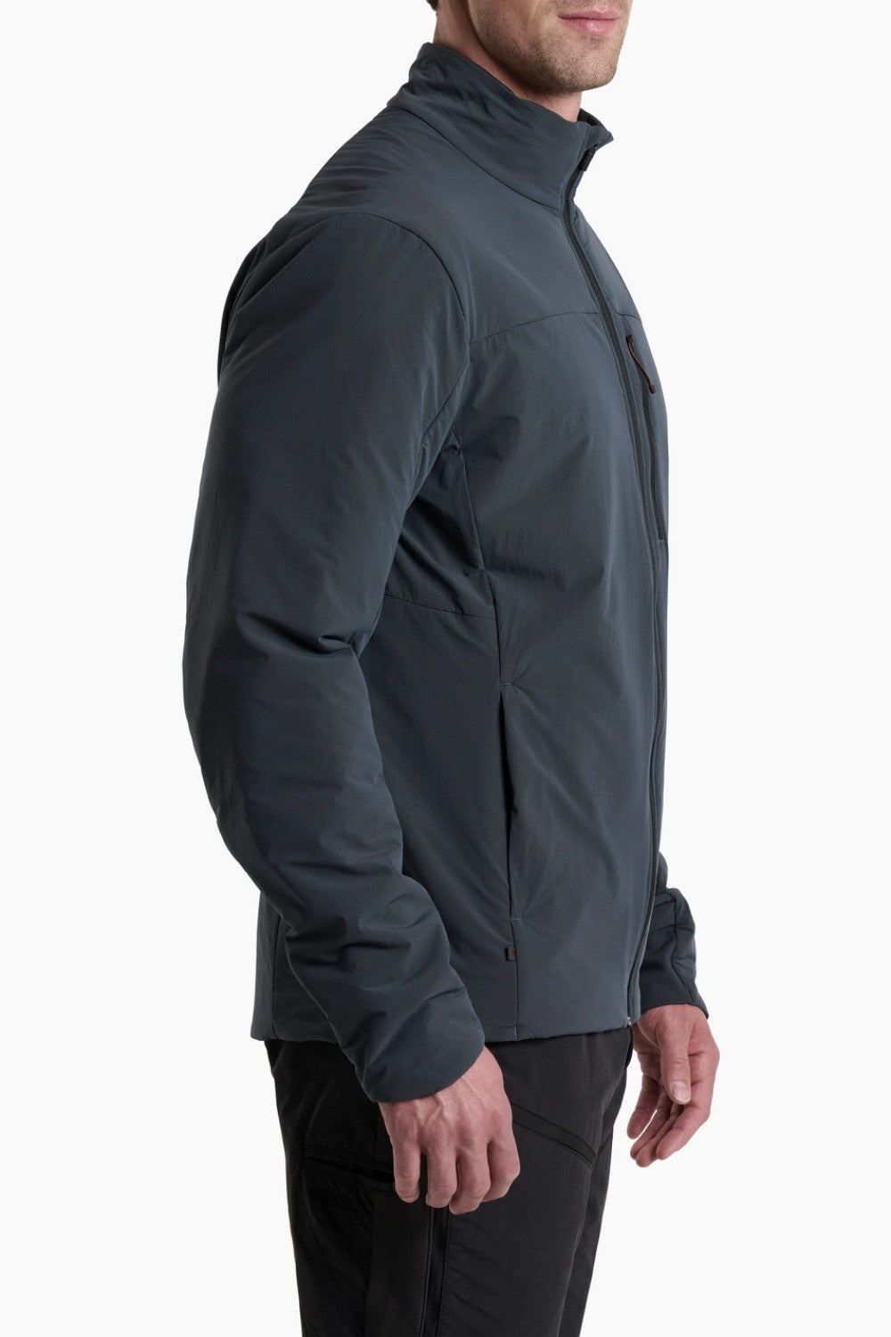 Person wearing a dark gray softshell jacket on a white background